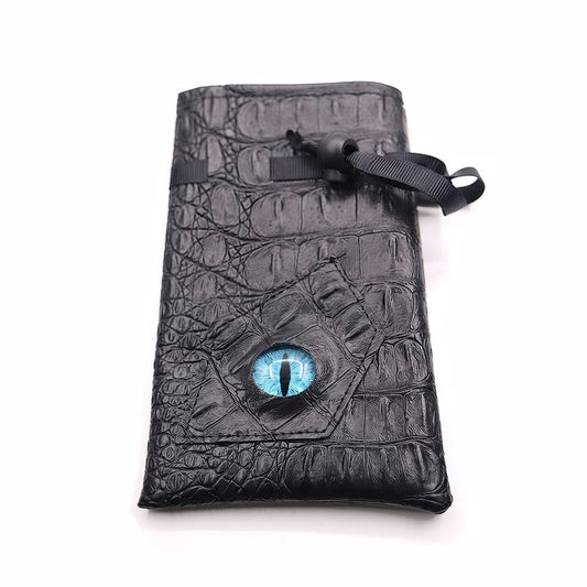 Azure Eye black textured drawstring DND dice bag with blue dragon eye design laid flat on white background.