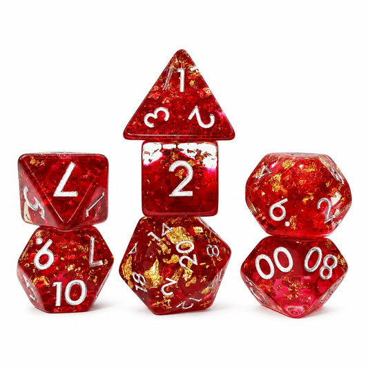 Phoenix Rebirth 7-piece red resin DND dice set with gold foil flakes and silver numbers on white background.
