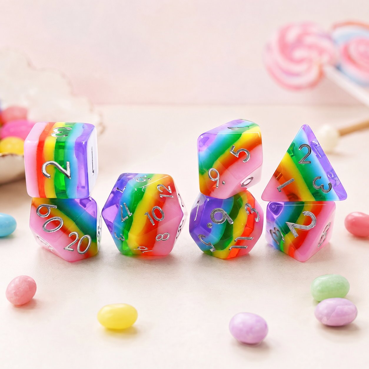 Rainbow Candy 7-piece resin DND dice set in a pastel candy scene with jelly beans and lollipops.