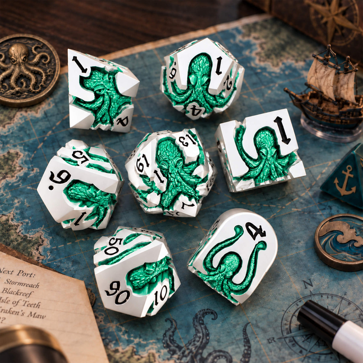 Seafoam Kraken 7-piece silver-tone metal DND dice set with seafoam green pearlescent kraken designs displayed on a nautical map with ocean-themed props.