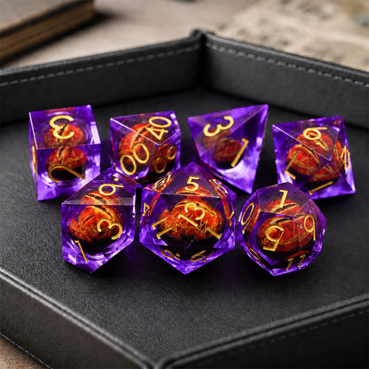 Amethyst Flame Dragon Eye 7-piece violet liquid core DND dice set with red dragon eyes and gold numbers in a black dice tray.