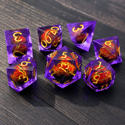Amethyst Flame Dragon Eye 7-piece violet liquid core DND dice set with red dragon eyes and gold numbers on a dark wood tabletop.