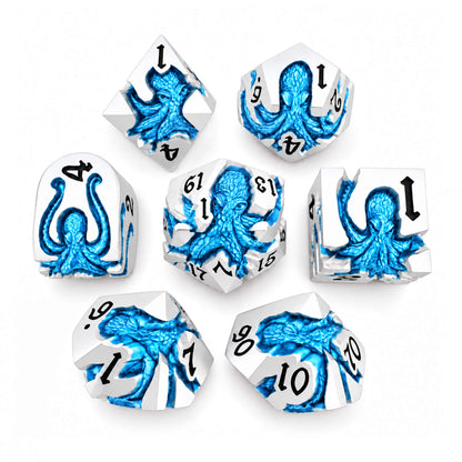 Cold Current Kraken 7-piece silver-tone metal DND dice set with blue pearlescent kraken designs and black numbers on a white background.