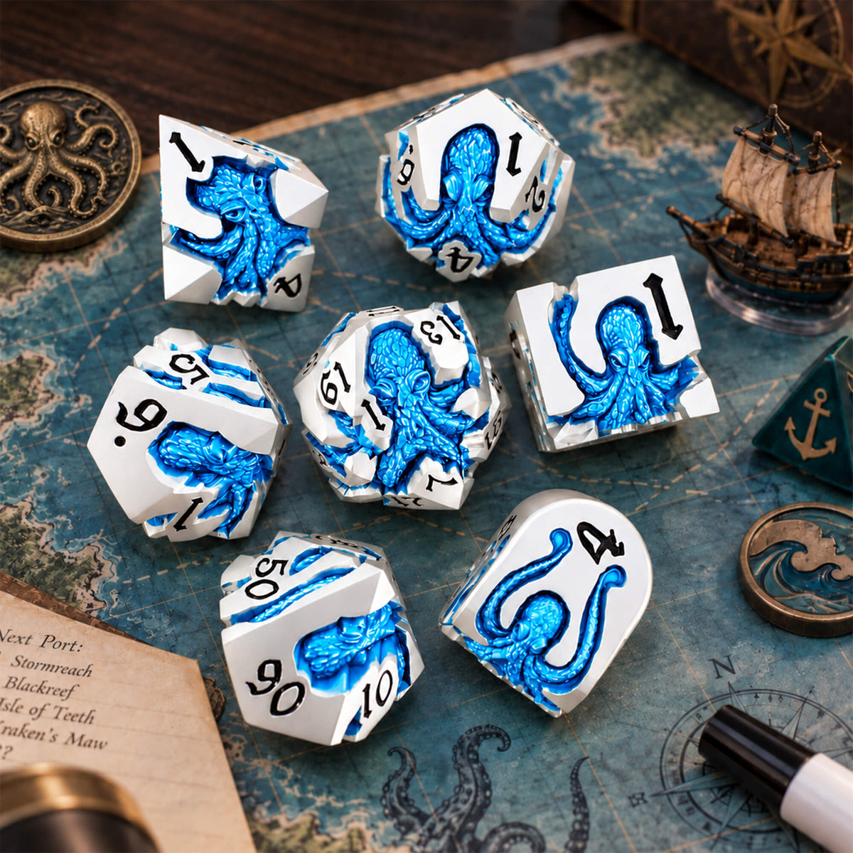 Cold Current Kraken 7-piece silver-tone metal DND dice set with blue pearlescent kraken designs displayed on a nautical map with ocean-themed props.