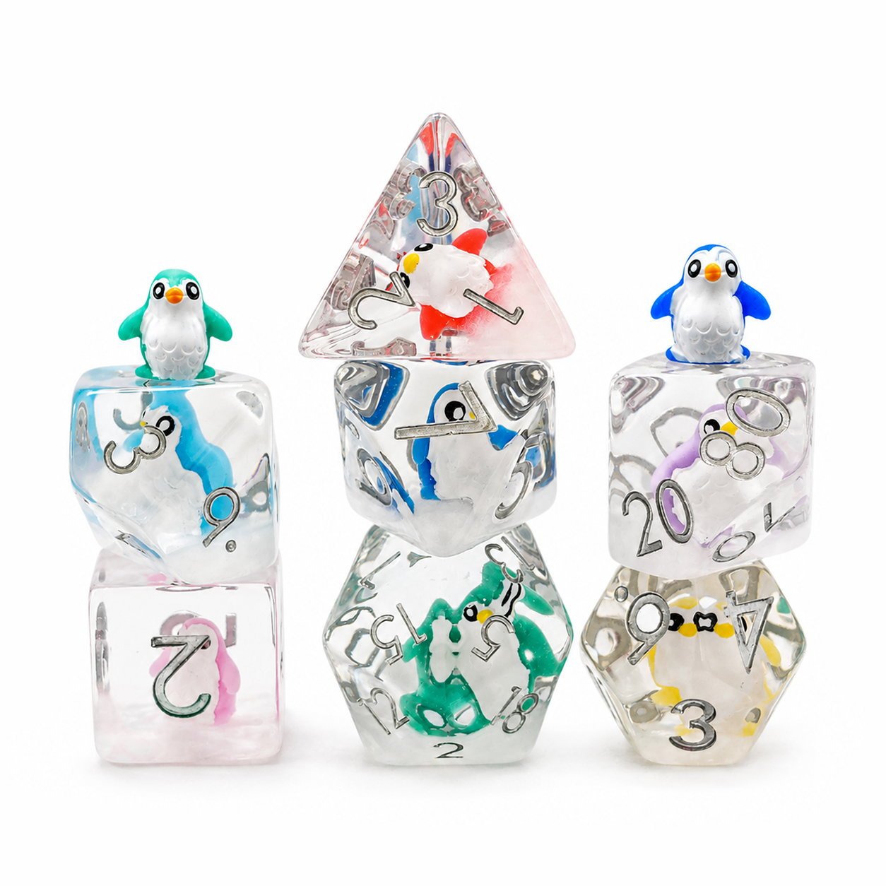 Colorful Penguin 7-piece clear resin embedded DND dice set with penguin figures on white background.