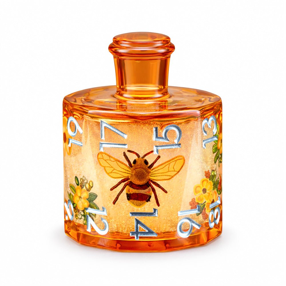 Honeyed Vial single D20 amber resin liquid core DND die with bee and flower motifs on white background.