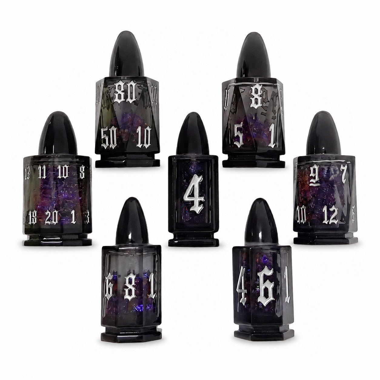 Midnight Assassin 7-piece black bullet-shaped liquid core DND dice set with iridescent flakes and silver numbers on white background.