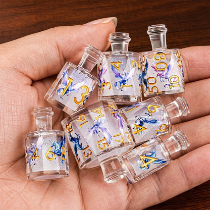 Pegacorn 7-piece clear resin liquid core DND dice set with pegacorn motifs held in hand.