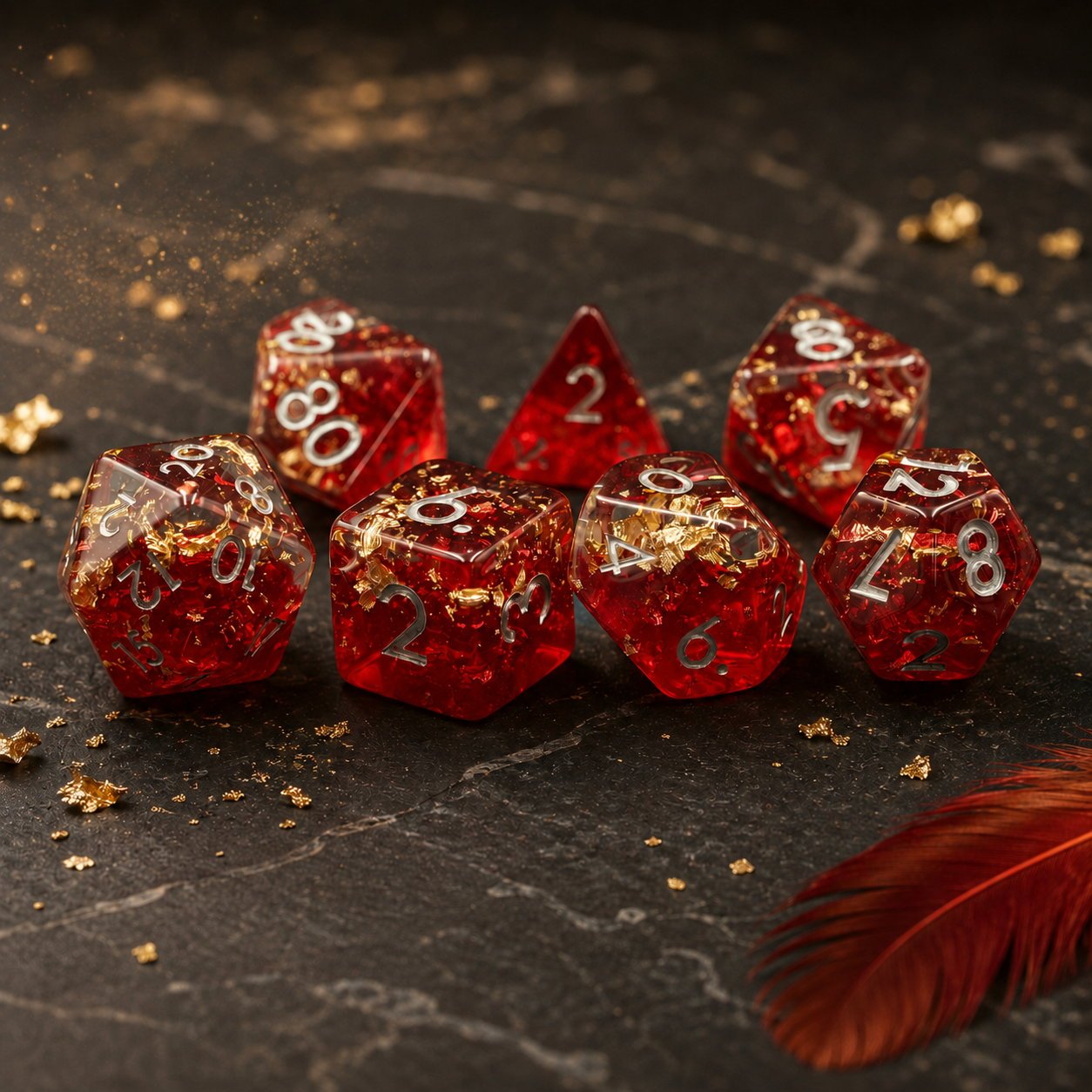 Phoenix Rebirth 7-piece resin DND dice set on a dark marble surface with gold flakes and a red feather.