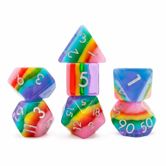 Rainbow Candy 7-piece rainbow layered resin DND dice set with silver numbers on white background.