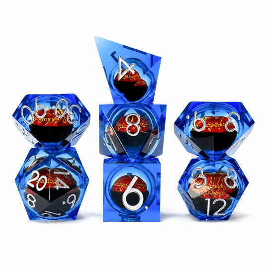 Sapphire Flame Dragon Eye 7-piece blue liquid core DND dice set with red dragon eyes and silver numbers on white background.