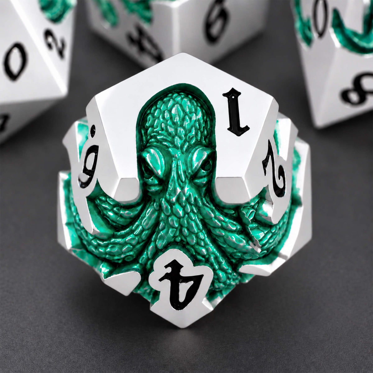 Seafoam Kraken silver-tone metal D12 featuring a seafoam green pearlescent kraken design and black numbers on a dark background.