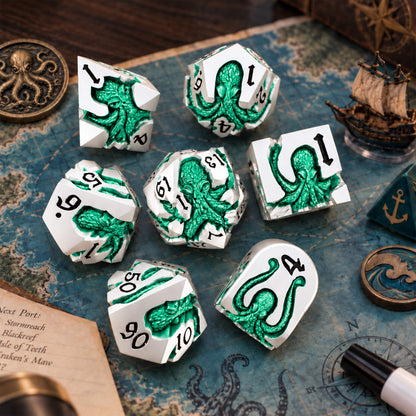 Seafoam Kraken 7-piece silver-tone metal DND dice set with seafoam green pearlescent kraken designs displayed on a nautical map with ocean-themed props.