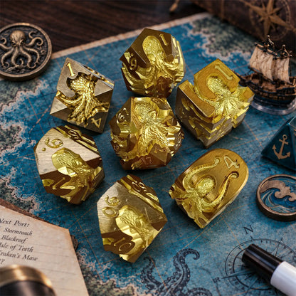 Sunken Crown Kraken 7-piece gold metal dice set with bright gold kraken designs in a nautical adventure game scene.