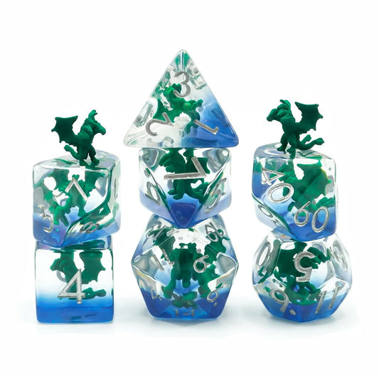 Swamp Hydra 7-piece clear resin embedded DND dice set with green hydra figures and blue base on white background.