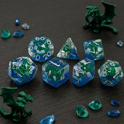Swamp Hydra 7-piece resin DND dice set with green hydra figures, crystals, and dragon figurines.