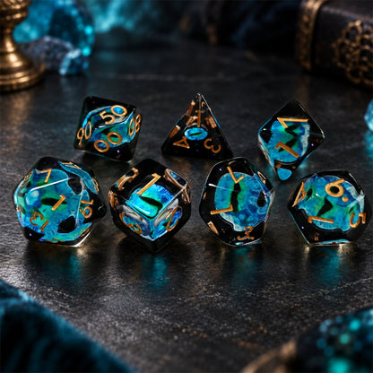 Tidal Dragon Eye 7-piece black resin DND dice set with blue-green dragon eyes and gold numbers in a dark scene with blue crystals.